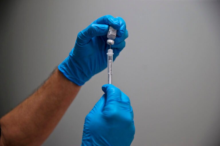 As Covid cases rise, CDC panel recommends new version of vaccine for fall