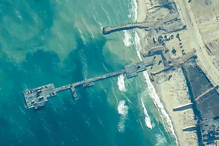 Temporary U.S. pier for crucial aid is reattached to Gaza beach, military says