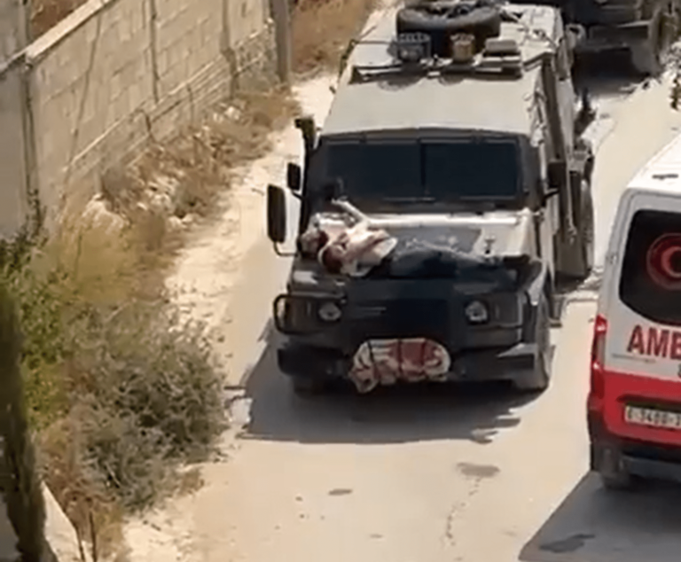 Video of Israeli soldiers driving with injured Palestinian strapped to a jeep sparks outrage