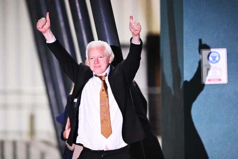 Julian Assange returns home a free man after U.S. plea deal