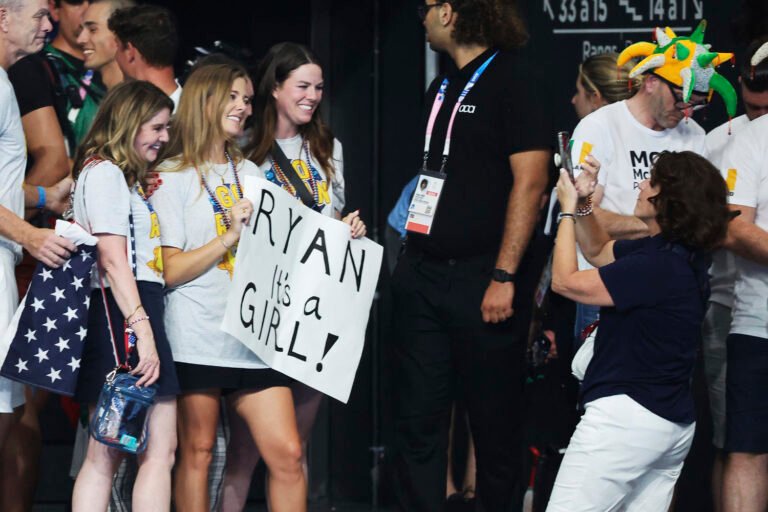 Swimmer Ryan Murphy's wife surprises him with a gender reveal after he collects his medal
