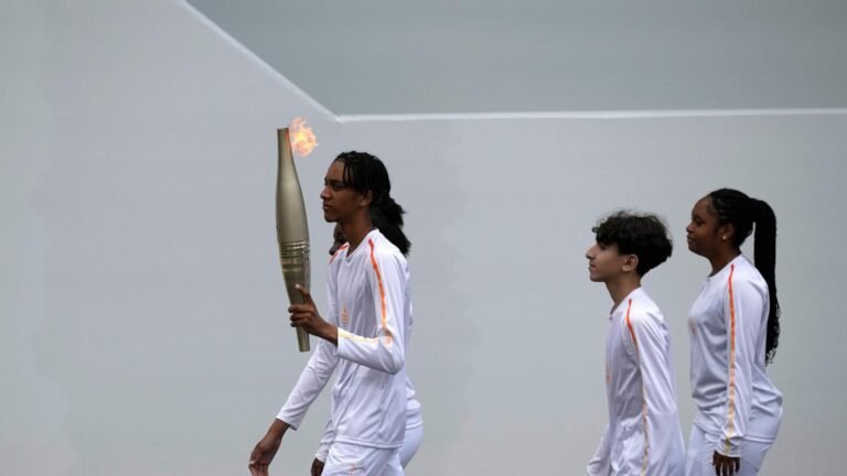 Who is carrying the Olympic torch through Paris? A BTS star, a garbage collector and more