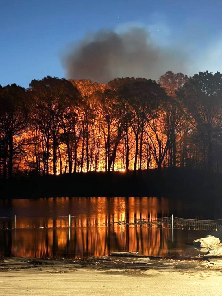 Wildfires rage across the Northeast amid warm, dry conditions